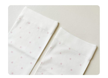 Bas cuissardes blancs à pois avec motif cuillère et nœud