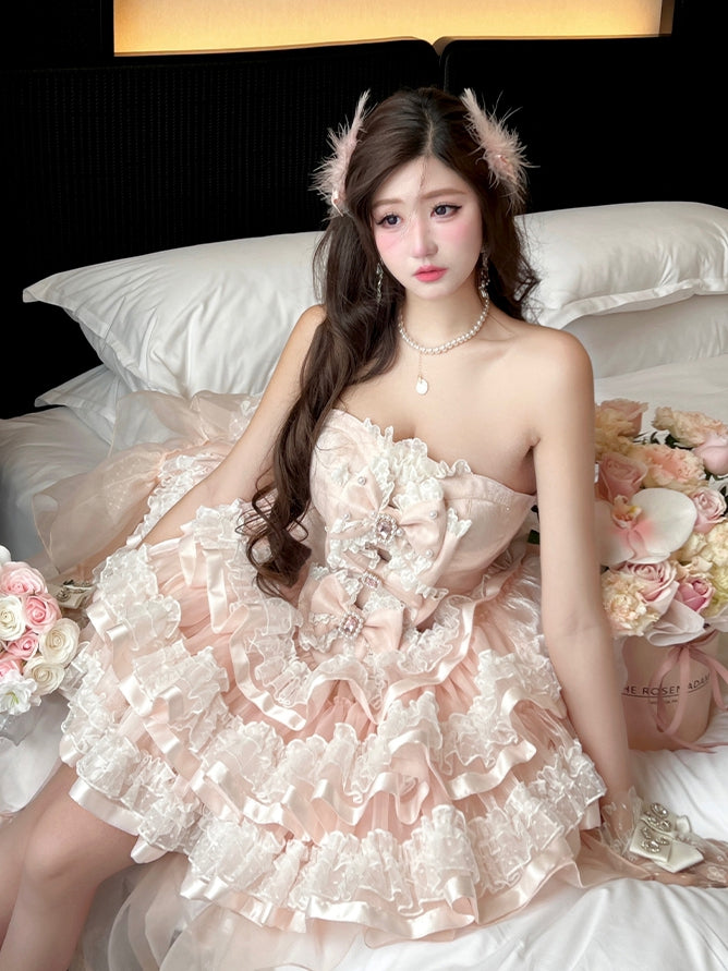 Robe bustier princesse d'anniversaire avec corsage décoré de nœuds roses et jupe superposée