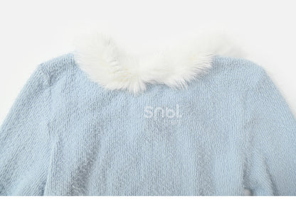 Haut à manches longues et col en peluche bleu avec détails nœud