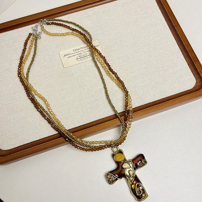 Gold/Brown Cross Pendant Triple Layered Beaded Necklace
