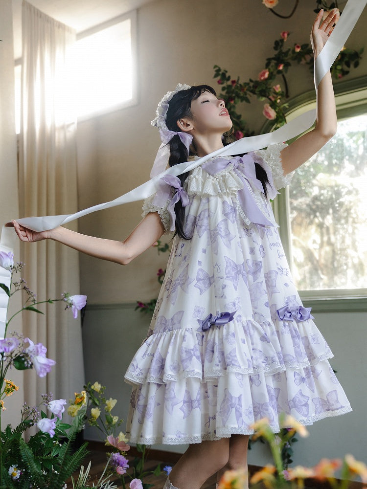 Robe Lolita violette à gros nœud sur le décolleté et imprimé nœuds double épaisseur