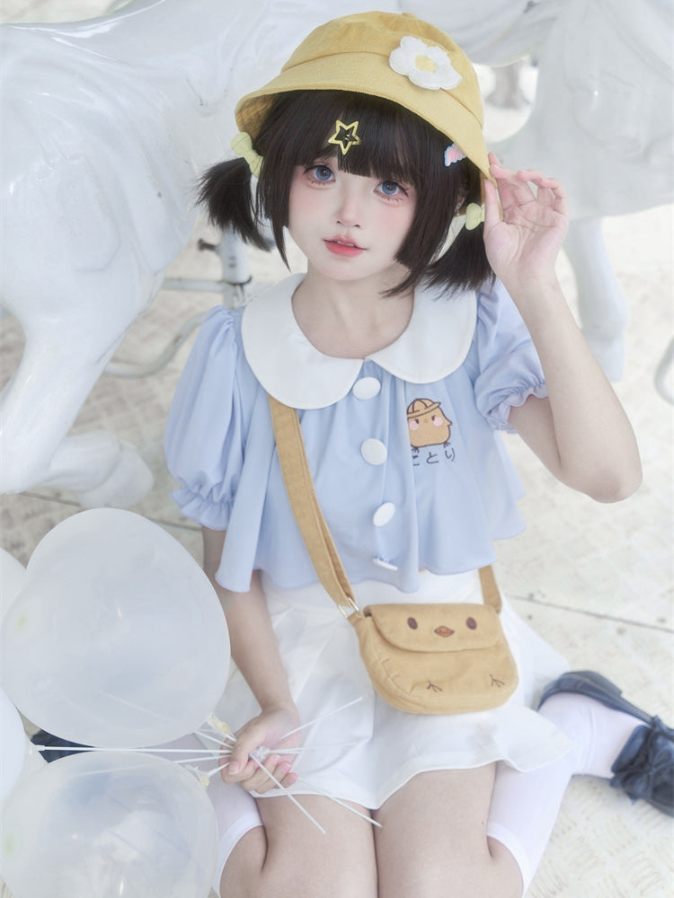 Ensemble haut col Claudine brodé bleu et jupe plissée blanche