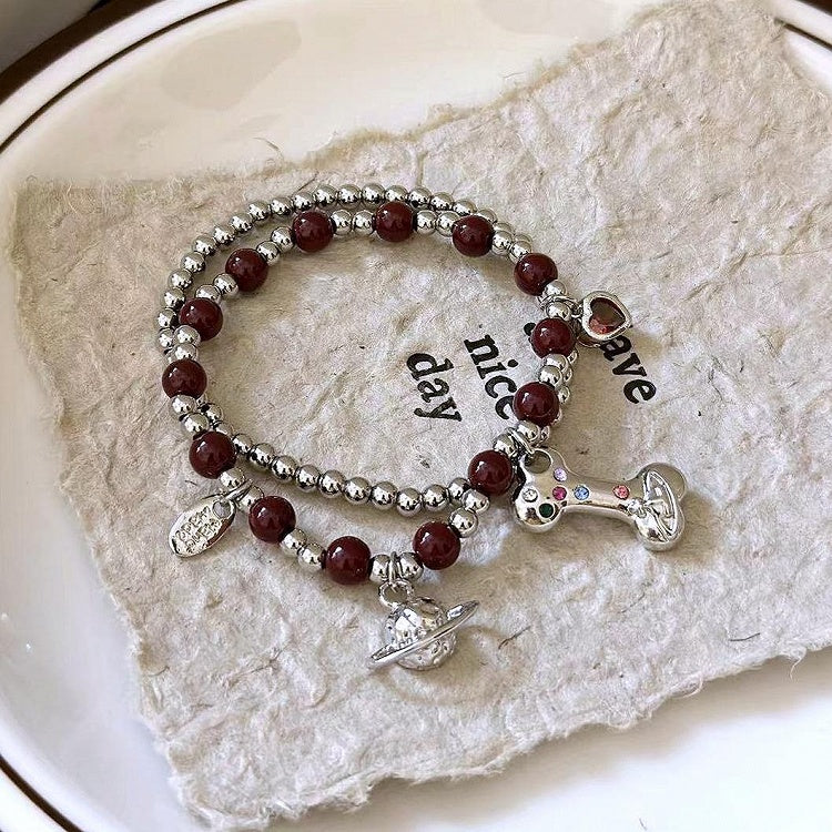 Bracelet à breloques en os de Saturne blanc/noir/rouge