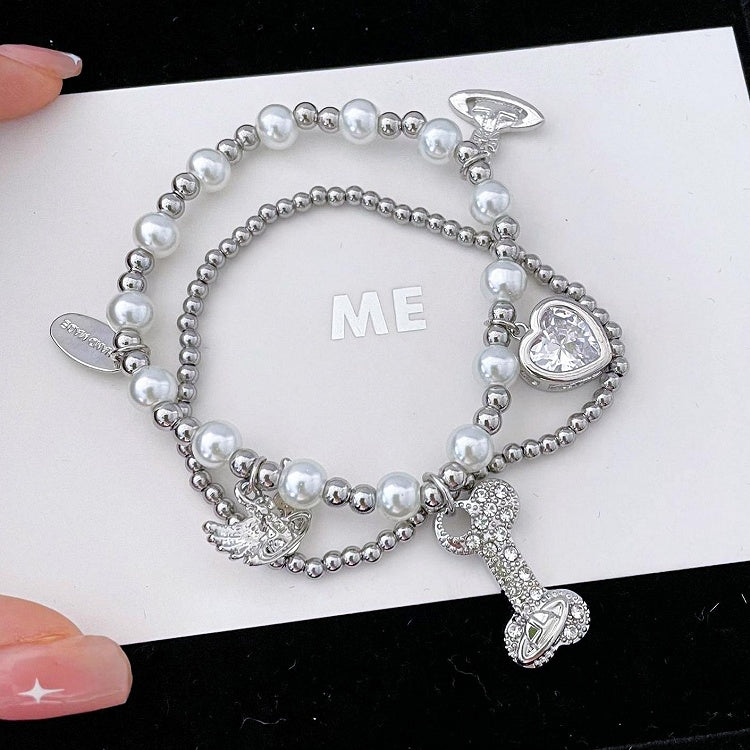 Bracelet à breloques en os de Saturne blanc/noir/rouge