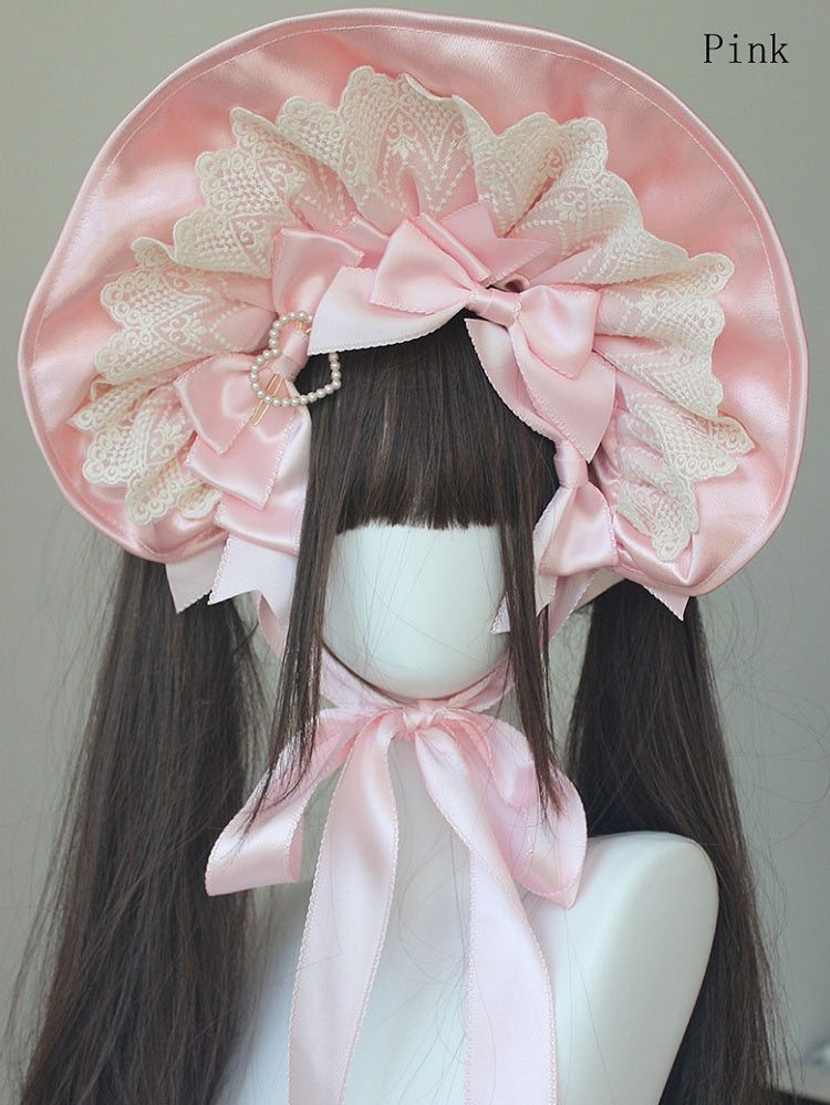 Bonnet à bordure en dentelle et nœud décoratif orné de perles