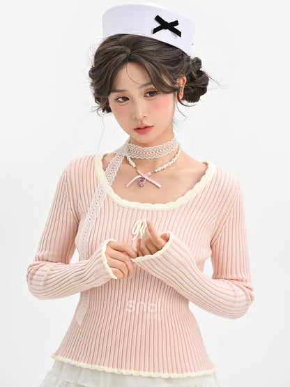 Haut en maille slim à col rond et détails nœud rose