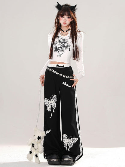 Haut court graphique en dentelle noire et blanche avec papillon dans le dos