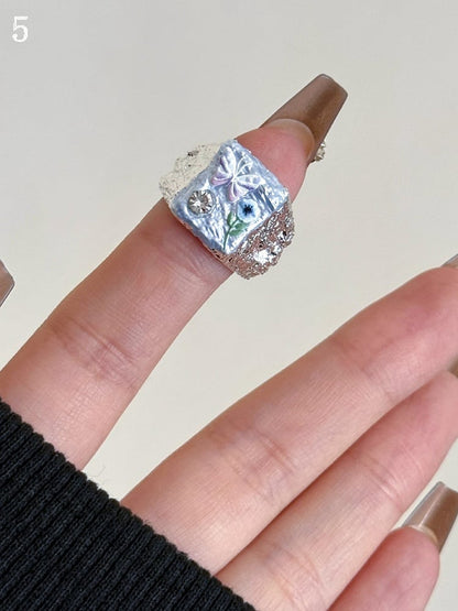8 Bittersüßer Schmetterling und Ring Blaues Blumendesign Y2K Optionen