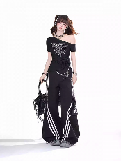 Schwarzes, asymmetrisches T-Shirt mit großer Schleife am Ausschnitt und Saum und glamouröser Grafik