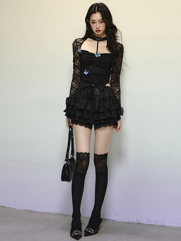 Schwarzes Neckholder-Top mit asymmetrischem Saum und verziertem Ausschnitt