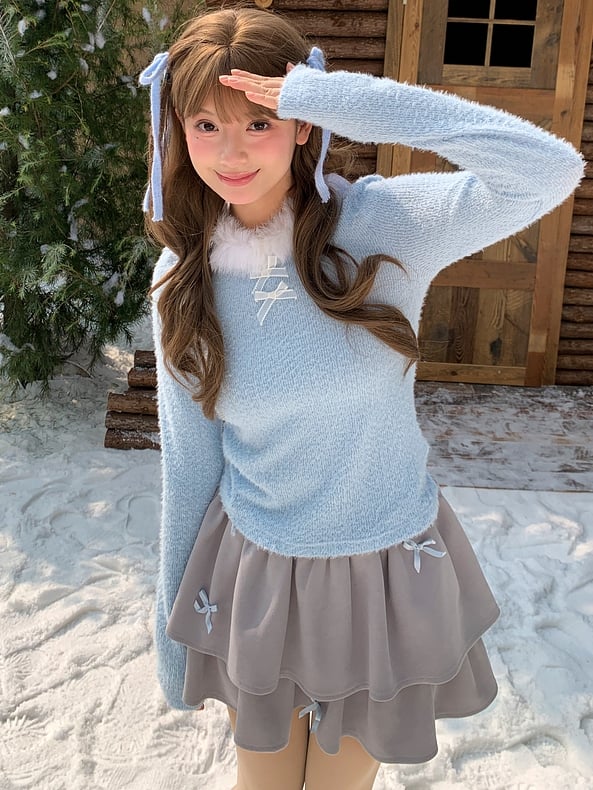 Haut à manches longues et col en peluche bleu avec détails nœud