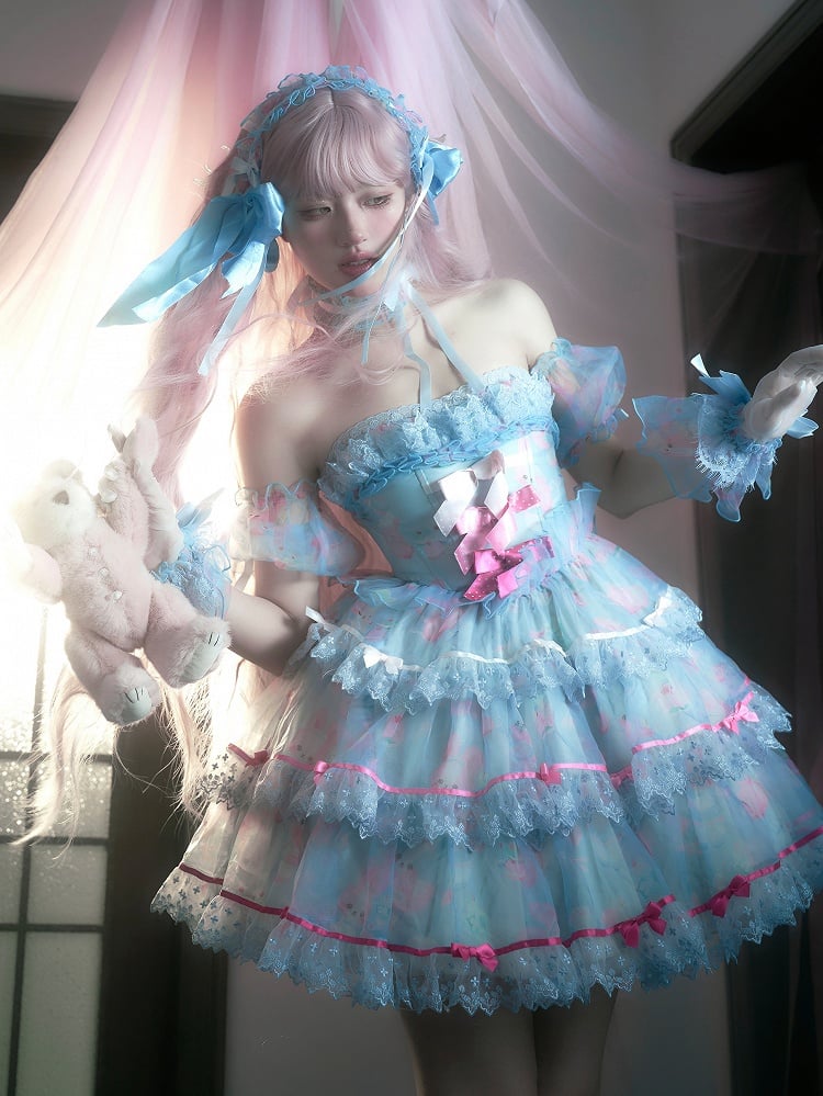 Robe bleue à armatures avec jupe à volants décorée de nœuds en satin et de lapin mignon
