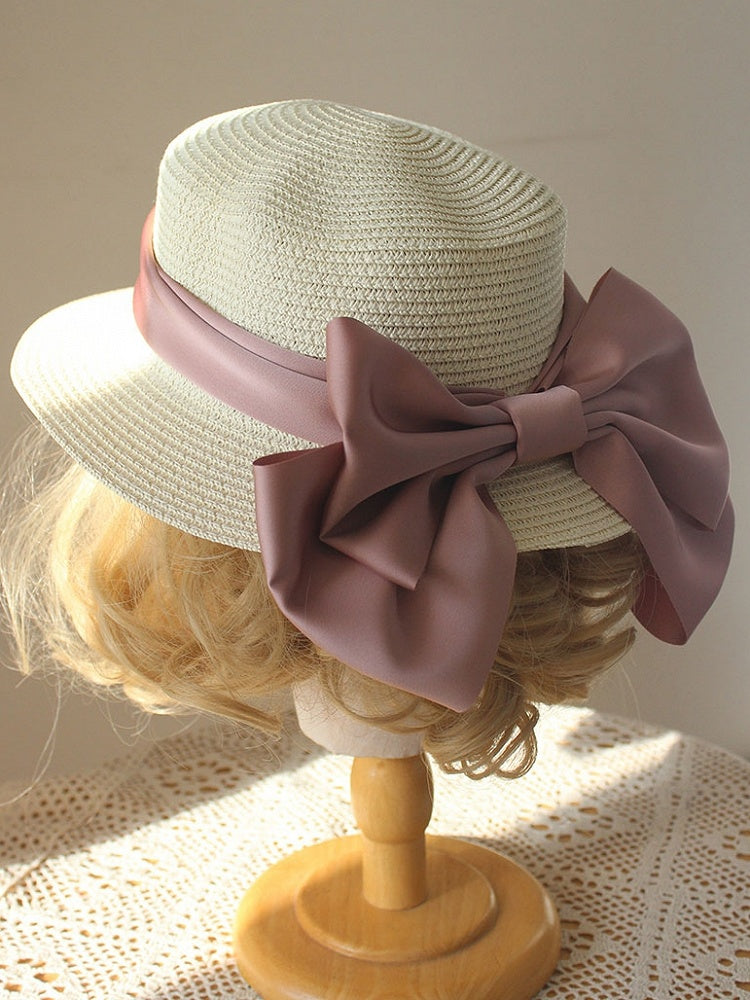 Chapeau de paille décoré d'un gros nœud