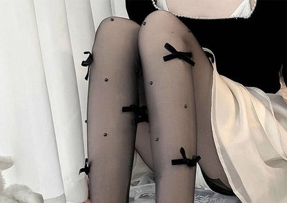 Strumpfhose mit Kunstperlenschleife