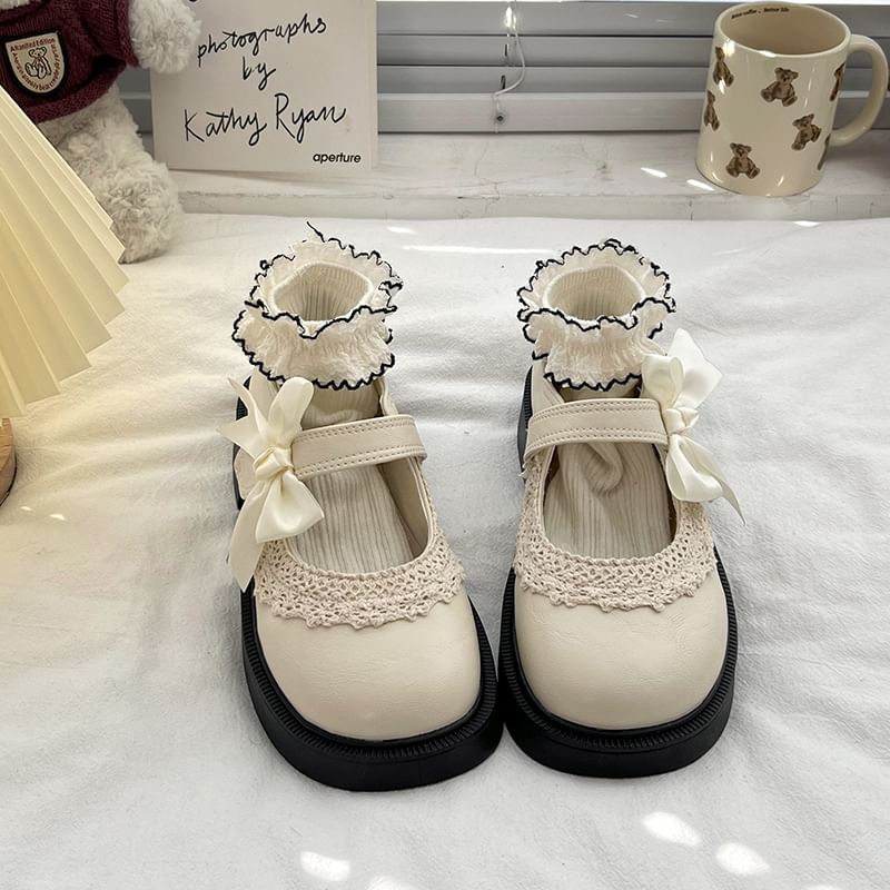 Mary Trim Jane Schuhe mit Schleife, Spitze und Plateau