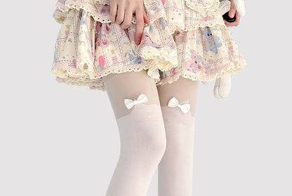 Transparente Strumpfhose mit Katzenmuster und Schleife