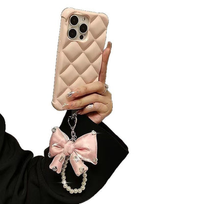 リボンとラインストーンチャームパッド付きフェイクパールストラップ付き携帯電話