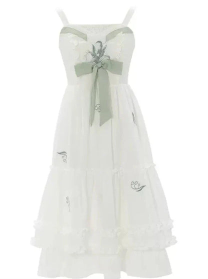 Costume vert menthe à bretelles + veste fleurie et robe à volants en ruban