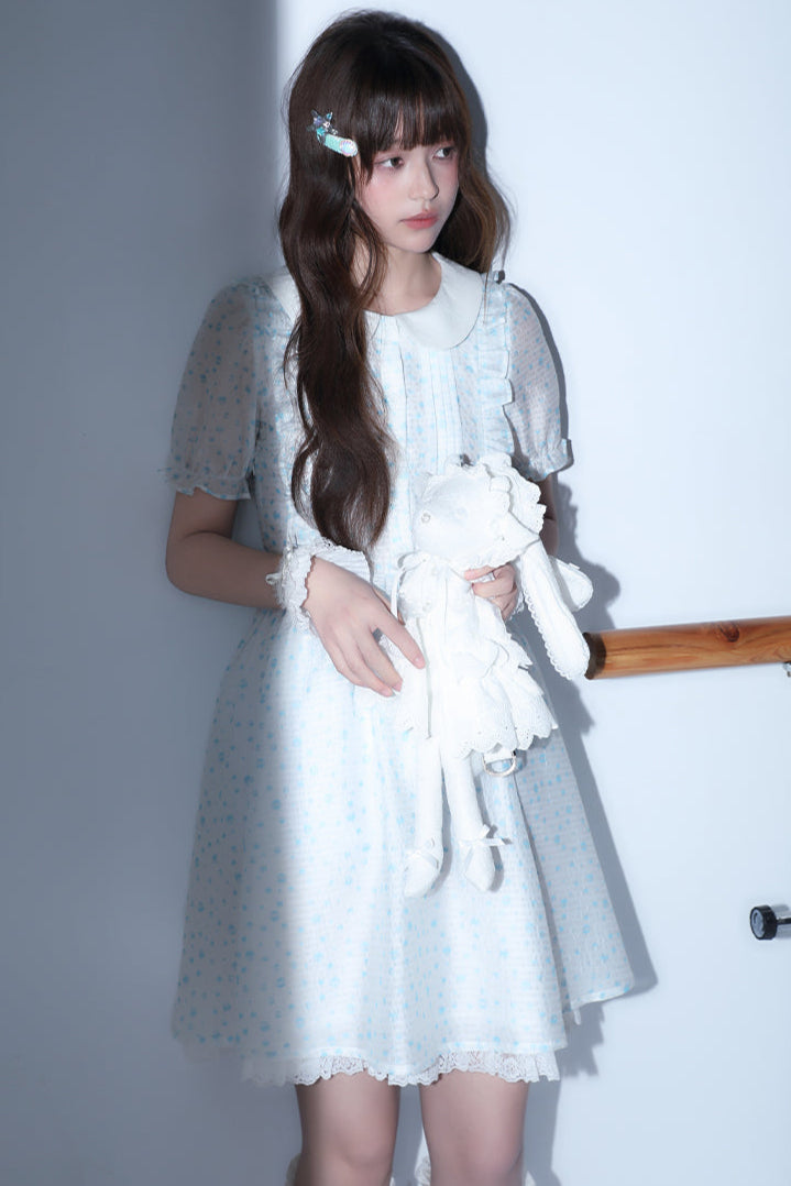 Puppe Ecosta Blumenkleid transparent