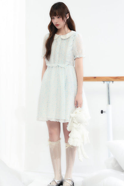 Puppe Ecosta Blumenkleid transparent