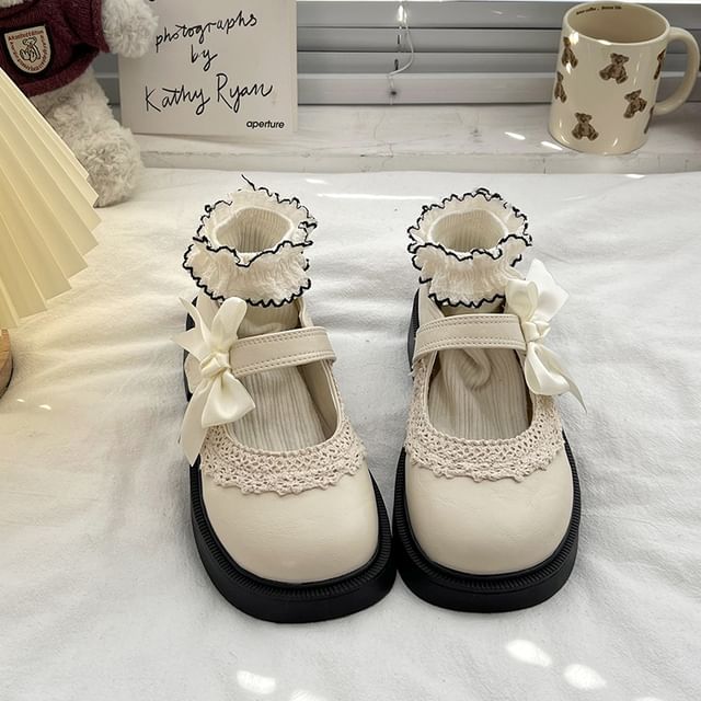 Mary Trim Jane Schuhe mit Schleife, Spitze und Plateau