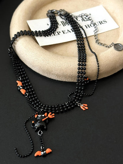 Collier pendentif petit diable rose/orange Y2K