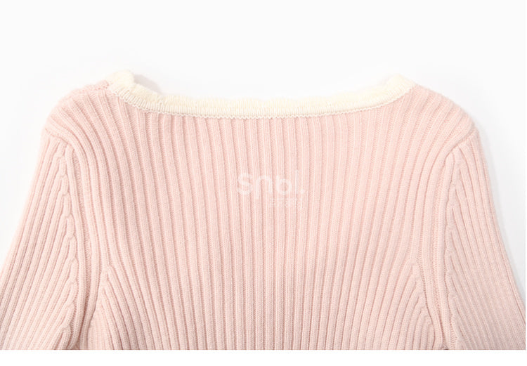 Haut en maille slim à col rond et détails nœud rose
