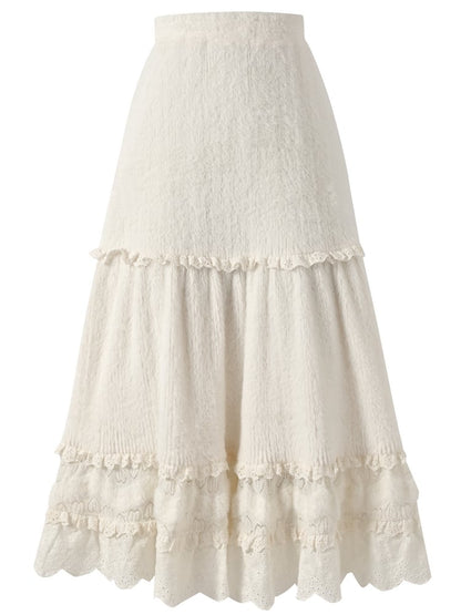 Jupe mi-longue beige taille haute avec détails en dentelle et ourlet à volants
