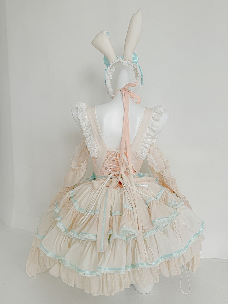 Robe bouffante sans bretelles à volants et taille basque avec tablier rose et vert menthe