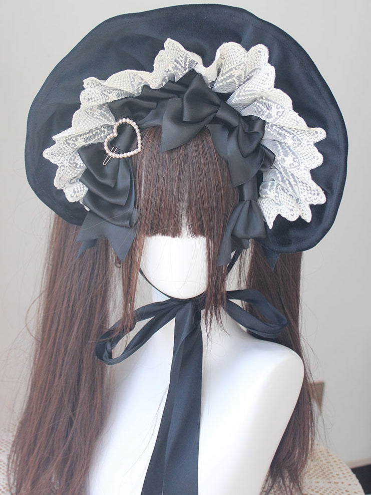 Bonnet à bordure en dentelle et nœud décoratif orné de perles