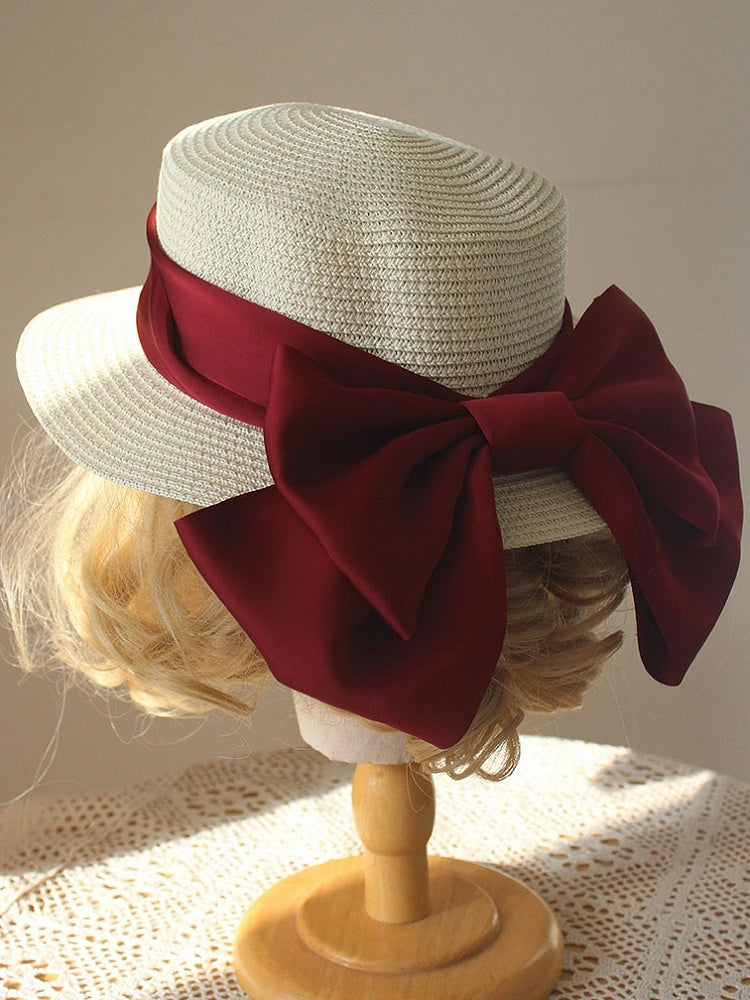 Chapeau de paille décoré d'un gros nœud