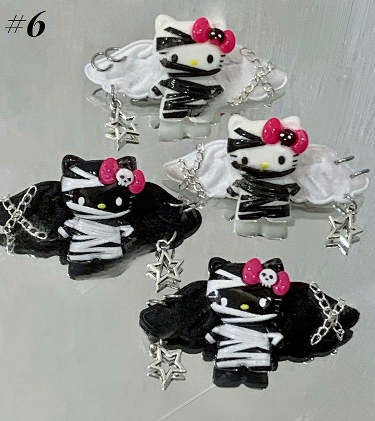 Pinces à cheveux Guro Kawaii Mummy Kitty noires/blanches