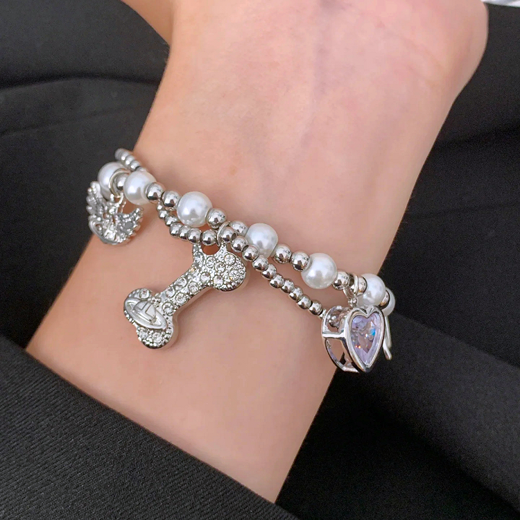 Bracelet à breloques en os de Saturne blanc/noir/rouge
