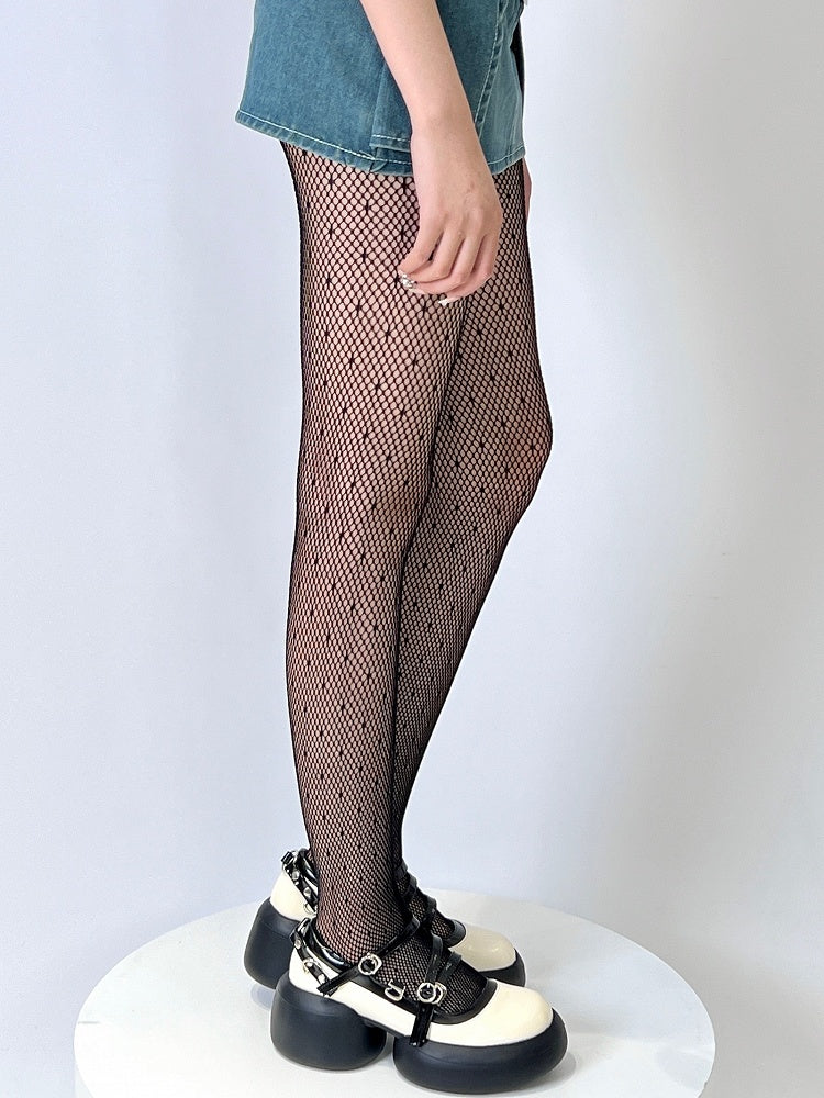 Strumpfhose mit schwarz-weißem Punktmuster