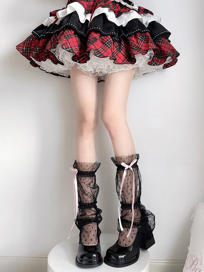Schwarze, halbtransparente Beinärmel mit Bogenmuster und Tupfenmuster