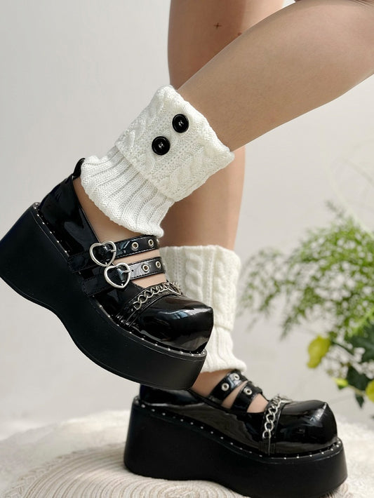 Jambières tricotées à boutons blancs