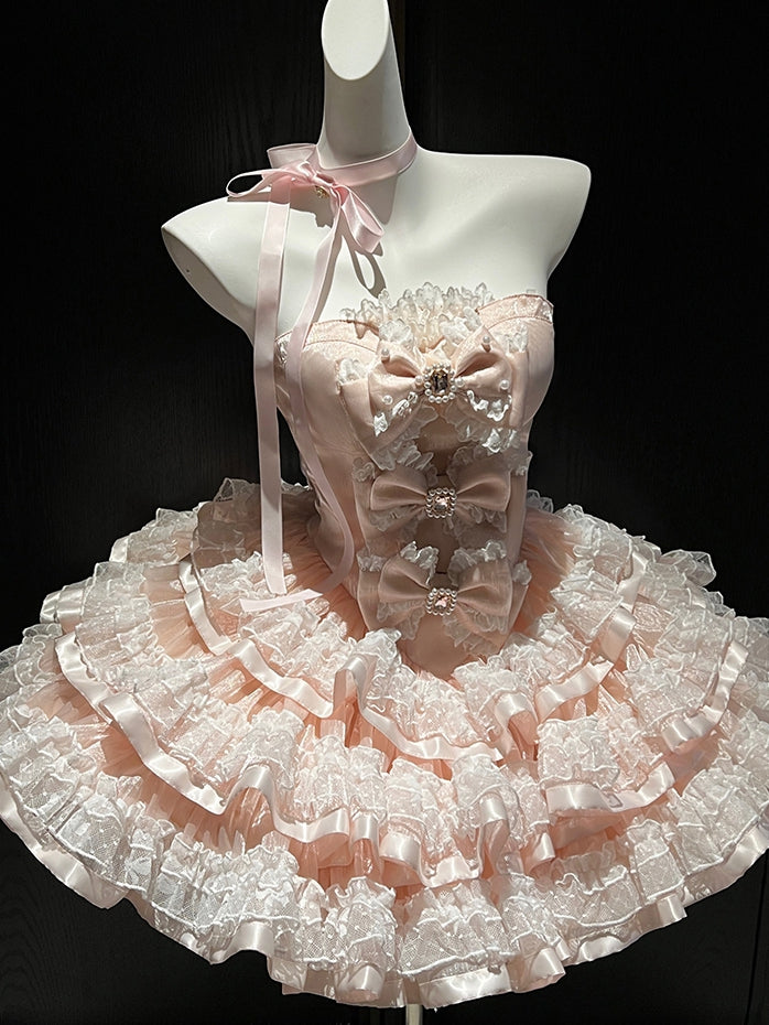 Robe bustier princesse d'anniversaire avec corsage décoré de nœuds roses et jupe superposée