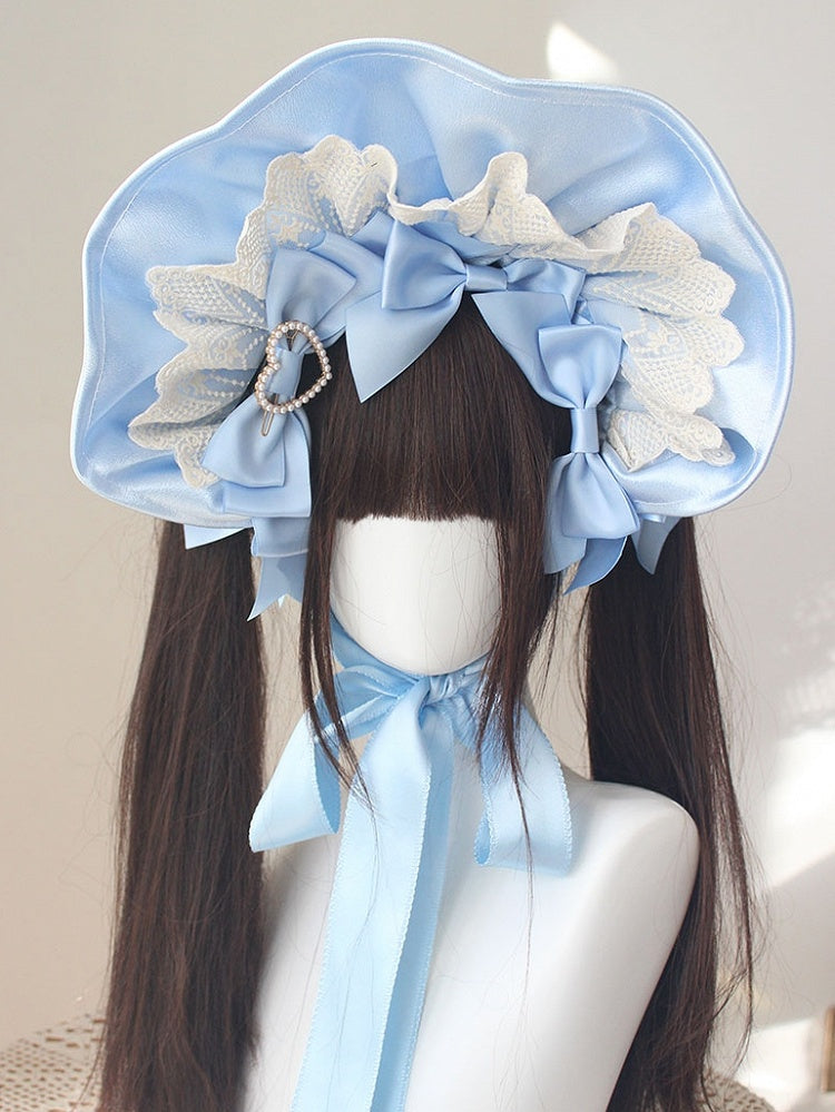 Bonnet à bordure en dentelle et nœud décoratif orné de perles