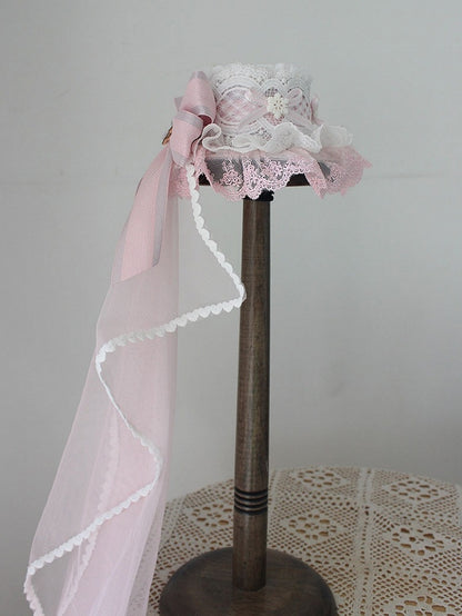 Chapeau haut-de-forme rose de Noël avec nœud en dentelle et voile