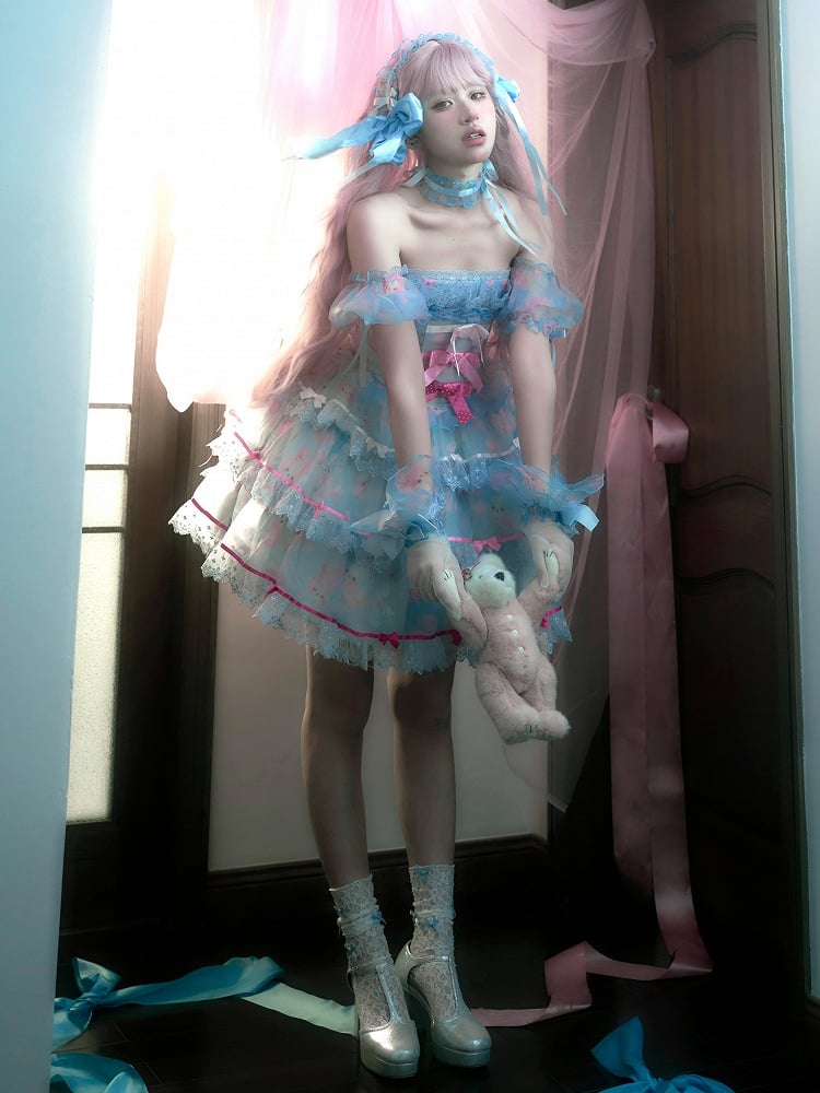 Robe bleue à armatures avec jupe à volants décorée de nœuds en satin et de lapin mignon