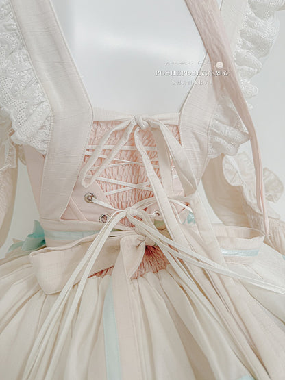 Robe bouffante sans bretelles à volants et taille basque avec tablier rose et vert menthe