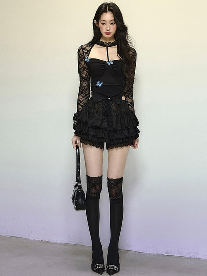 Schwarzes Neckholder-Top mit asymmetrischem Saum und verziertem Ausschnitt