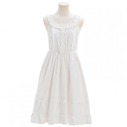 Robe blanche sans manches à volants et nœuds