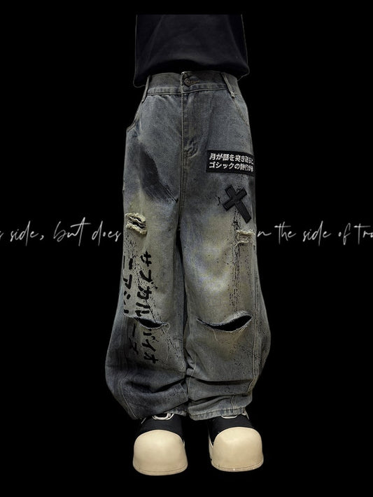 Jeans mit weitem Bein und Applikationen und blauen Schnittdetails mit gekreuzten Distressed-Löchern