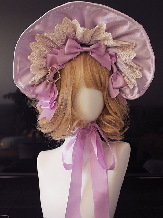 Bonnet à bordure en dentelle et nœud décoratif orné de perles