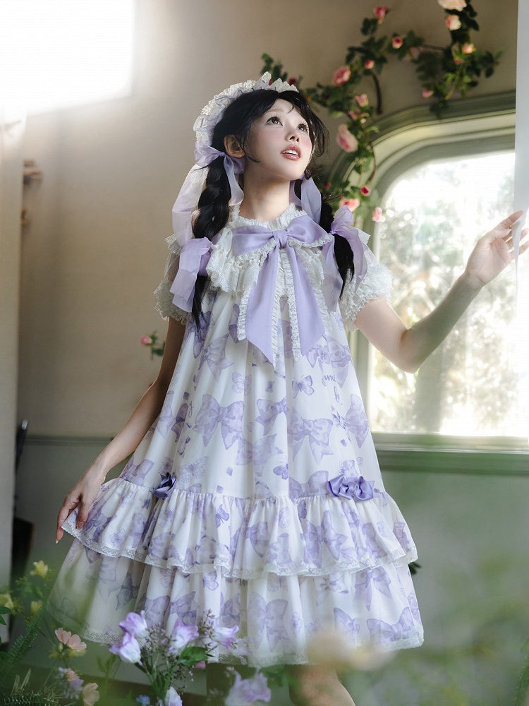Robe Lolita violette à gros nœud sur le décolleté et imprimé nœuds double épaisseur