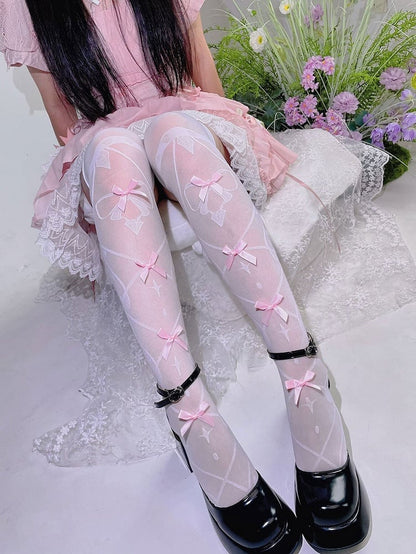 Bas semi-transparents au-dessus du genou avec nœud blanc et rose