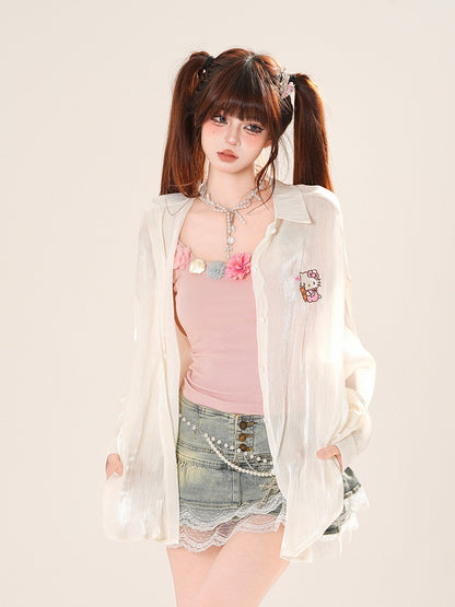 Sonnenschutz-Shirt mit Herzmotiv in Rosa/Aprikose und Rüschenschleife auf der Rückseite