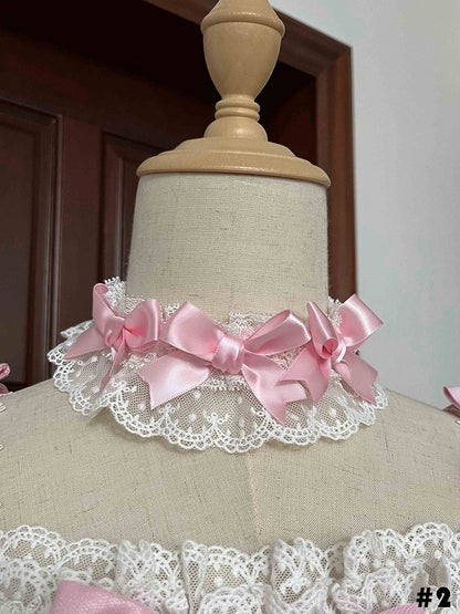 Rosa Choker mit weißen Schleifen