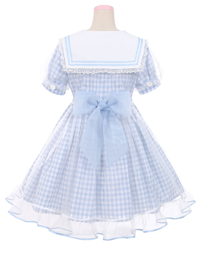 Robe à carreaux bleu clair à col marin et marguerites blanches, détails nœud papillon